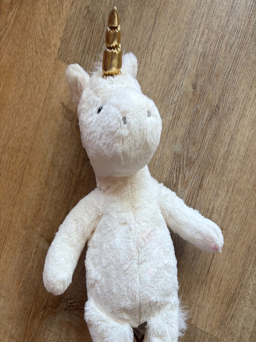 White pottery barn stuffed unicorn with gold horn